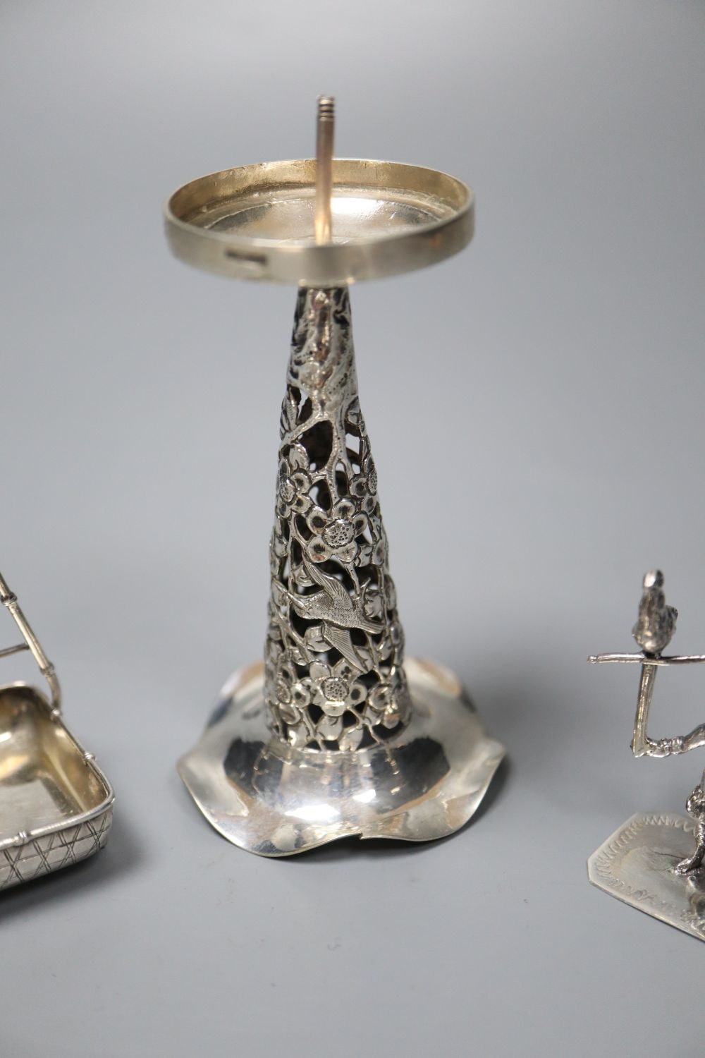 Two Dutch white metal sifter spoons, a Chinese white metal vase (base missing0 and two toy items, Dutch & Chinese.